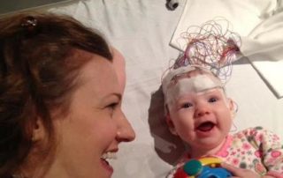 baby with eeg leads on