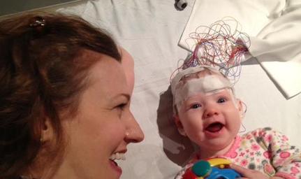 baby with eeg leads on